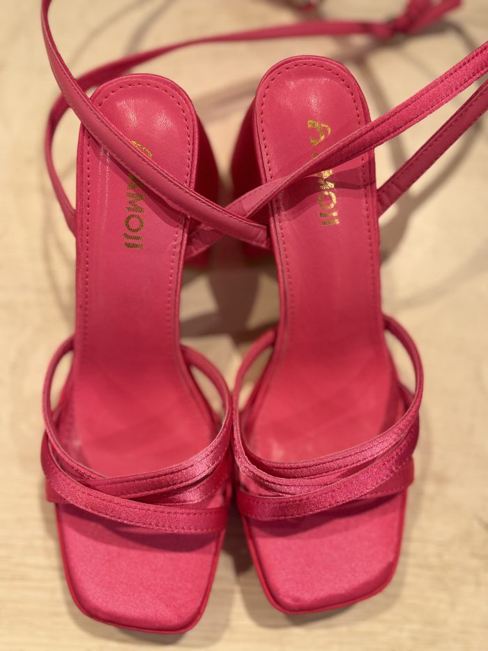 bright pink satin heeled sandals with delicate lace trim and slim ankle straps